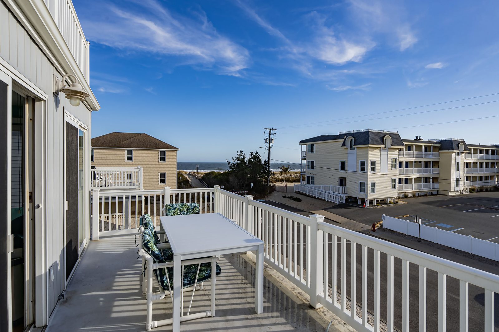 Front deck with dining table and ocean views
